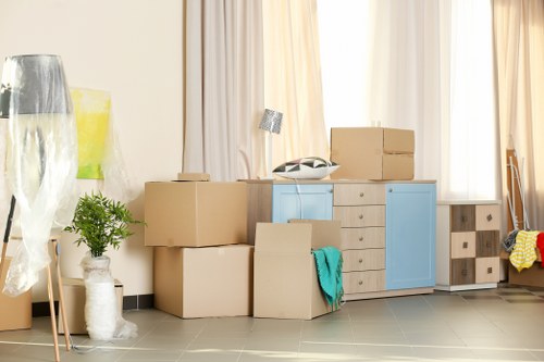 Careful loading of household items for a move in Queensbury