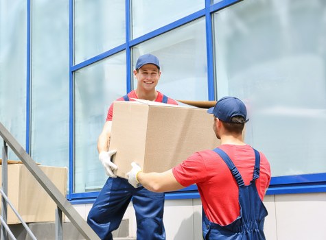 Man with van loading moving boxes in Queensbury