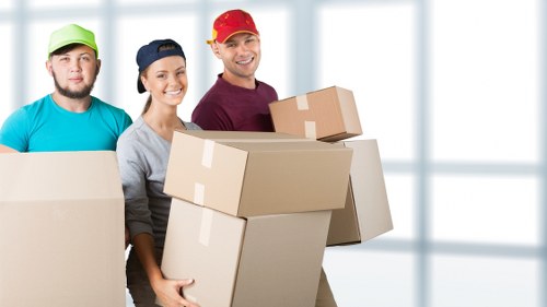 Packed moving boxes ready for a local van removal service