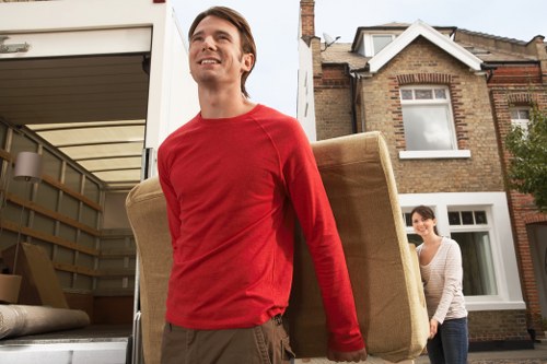 Staff using protective equipment during a van move