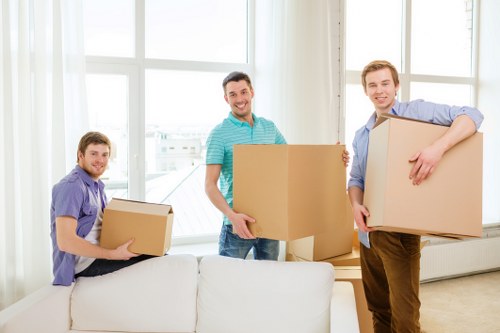 Careful loading of office equipment for a move in Queensbury
