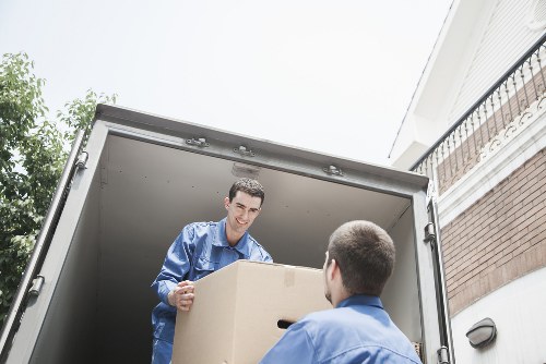 Queensbury home moving preparation with labelled boxes and wrapped items