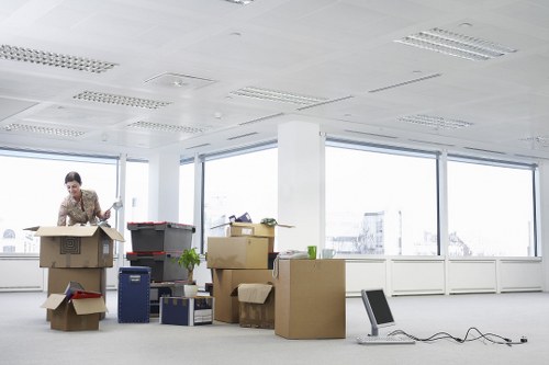 Staff carrying furniture with safety awareness during a move