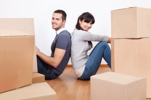 Furniture and boxes being handled during a house move in Queensbury