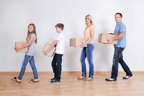 Packed boxes and furniture prepared for a house removal service