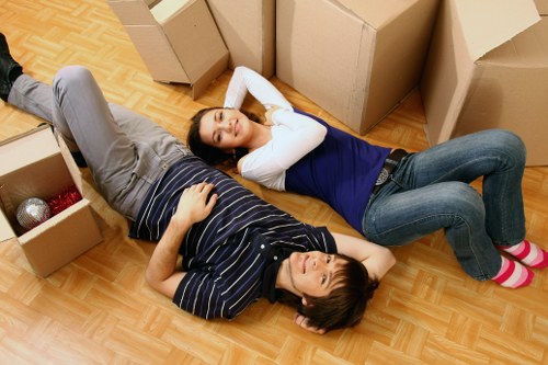 Local office moving team handling furniture in Queensbury
