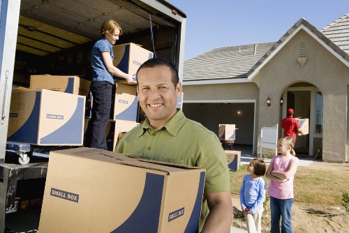 Business relocation items being loaded into a removals van